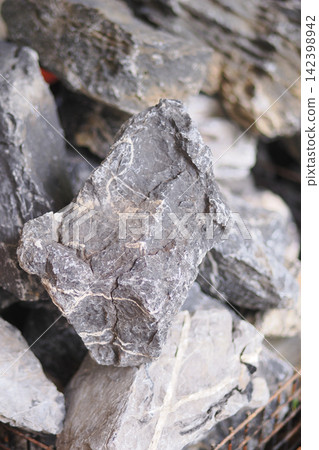 Rocks piled together in a construction site area Rocks piled together in a construction site area 142398942