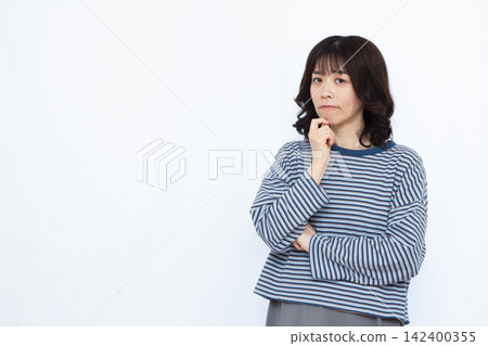 A woman who is seriously worried A woman who is seriously worried 142400355