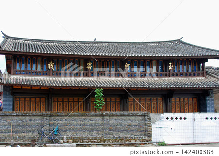 Lijiang Ancient City, Yunnan Province, China: A two-story ancient building, a guesthouse. Lijiang Ancient City, Yunnan Province, China: A two-story ancient building, a guesthouse. 142400383