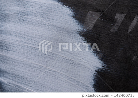 White paint on black construction paper White paint on black construction paper 142400733