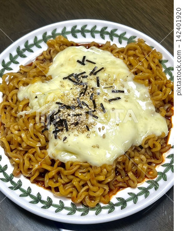 Spicy buldak ramyeon with fiery hot sauce and chewy noodles, delivering an intense, flavorful kick in every bite. A perfect choice for those who crave bold, spicy Korean comfort food. Spicy buldak ramyeon with fiery hot sauce and chewy noodles, delivering an intense, flavorful kick in every bite. A perfect choice for those who crave bold, spicy Korean comfort food. 142401920