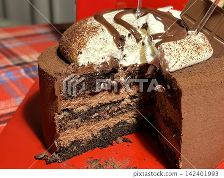 Rich, moist chocolate cake with a decadent, velvety texture and deep chocolate flavor. A perfect indulgence for dessert lovers, offering a satisfyingly sweet treat in every bite. Rich, moist chocolate cake with a decadent, velvety texture and deep chocolate flavor. A perfect indulgence for dessert lovers, offering a satisfyingly sweet treat in every bite. 142401993