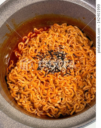 Spicy buldak ramyeon with fiery hot sauce and chewy noodles, delivering an intense, flavorful kick in every bite. A perfect choice for those who crave bold, spicy Korean comfort food. Spicy buldak ramyeon with fiery hot sauce and chewy noodles, delivering an intense, flavorful kick in every bite. A perfect choice for those who crave bold, spicy Korean comfort food. 142401999
