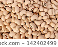 Close-up of beige chickpeas in a pile for cooking or food 142402499
