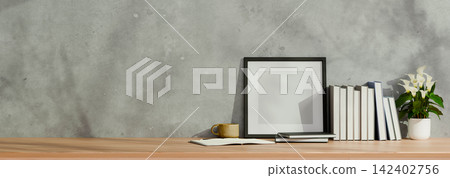 3D Illustration of Minimalist Workspace with Picture Frame Mockup, Books, Coffee Cup and Flower Pot on Wooden Desk 3D Illustration of Minimalist Workspace with Picture Frame Mockup, Books, Coffee Cup and Flower Pot on Wooden Desk 142402756