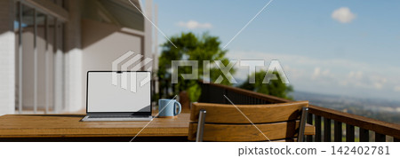 3D Illustration of Laptop with Blank Screen Mockup on Wooden Table on Modern Balcony with Scenic View 3D Illustration of Laptop with Blank Screen Mockup on Wooden Table on Modern Balcony with Scenic View 142402781