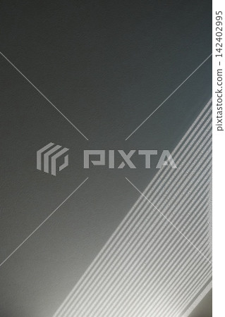 Abstract background photograph of light and shadow filtering through blinds Abstract background photograph of light and shadow filtering through blinds 142402995