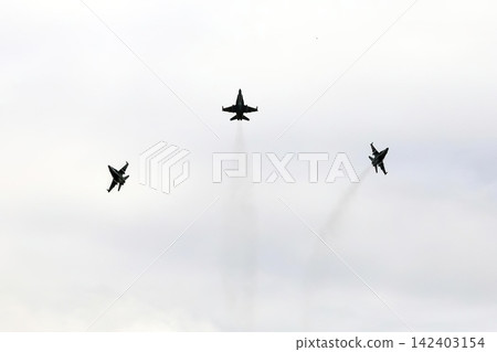 Three fighter jets flying in sky with trails during day Three fighter jets flying in sky with trails during day 142403154