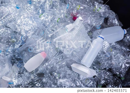 Recycling plastic bottles and waste in a trash bin Recycling plastic bottles and waste in a trash bin 142403371