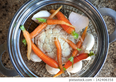 Preparing a healthy, vegetarian meal Preparing a healthy, vegetarian meal 142406358