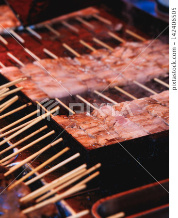 Wagyu beef skewers grilling on hot teppanyaki teppan iron plate, premium Japanese marbled meat on wooden sticks, traditional street food festival, Tokyo, Japan, market with local vendor stalls cooking Wagyu beef skewers grilling on hot teppanyaki teppan iron plate, premium Japanese marbled meat on wooden sticks, traditional street food festival, Tokyo, Japan, market with local vendor stalls cooking 142406505