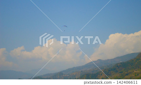 birds flying over the mountain and blue sky birds flying over the mountain and blue sky 142406611