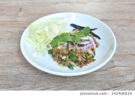 spicy crispy fried chop catfish meat with shallot and chili salad eat couple cabbage on plate spicy crispy fried chop catfish meat with shallot and chili salad eat couple cabbage on plate 142406816