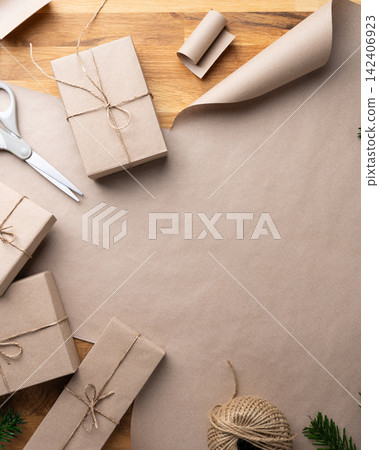 Handmade Christmas gift wrapping with natural holiday decorations, top view Handmade Christmas gift wrapping with natural holiday decorations, top view 142406923