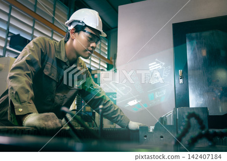Engineers and workers work in the factory. Engineers and workers work in the factory. 142407184