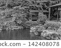 A lyrical scene of a gazebo and stone lantern standing in the Kamiike Garden, captured in black and white shadows. March 2024. 142408078