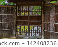 The inner gate of Senshintei, filled with the warmth of wood, and the delicate bamboo fence approach. March 2024. 142408236