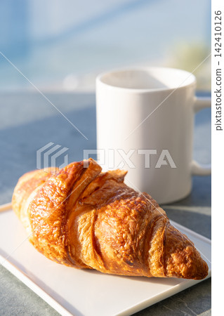 Delicious authentic French croissant breakfast Delicious authentic French croissant breakfast 142410126