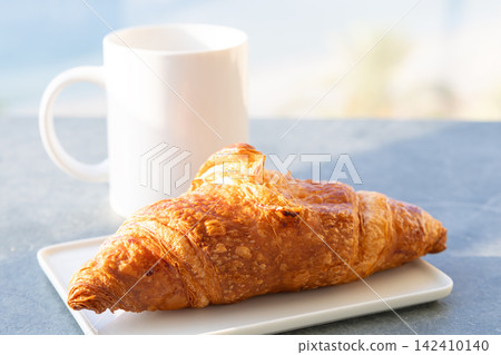 Delicious authentic French croissant breakfast Delicious authentic French croissant breakfast 142410140