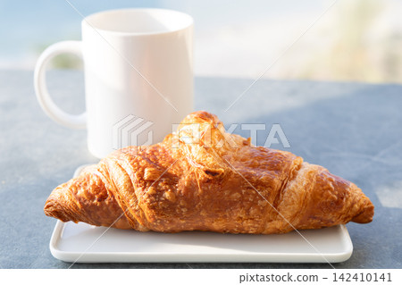 Delicious authentic French croissant breakfast Delicious authentic French croissant breakfast 142410141