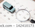 A car, a calendar, and a magnifying glass 142410173
