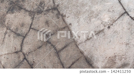 Surface texture of old concrete with a network of cracks Surface texture of old concrete with a network of cracks 142411250