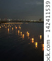 Kurume floating lanterns illuminate the surface of the Chikugo River in Kurume City, Fukuoka Prefecture. 142411539
