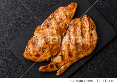Grilled chicken steak seasoned with salt and spices. Chicken steak Grilled chicken steak seasoned with salt and spices. Chicken steak 142412330