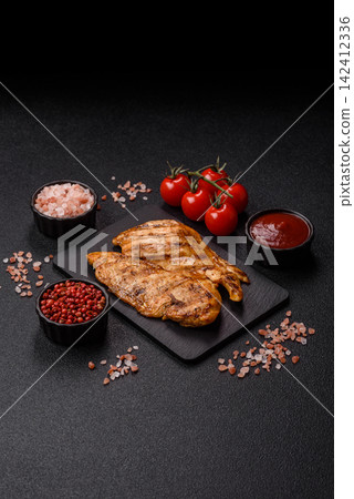 Grilled chicken steak seasoned with salt and spices. Chicken steak 142412336