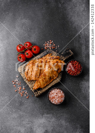 Grilled chicken steak seasoned with salt and spices. Chicken steak Grilled chicken steak seasoned with salt and spices. Chicken steak 142412338