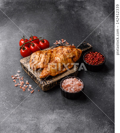 Grilled chicken steak seasoned with salt and spices. Chicken steak Grilled chicken steak seasoned with salt and spices. Chicken steak 142412339