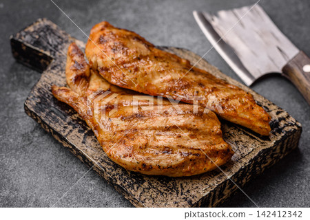 Grilled chicken steak seasoned with salt and spices. Chicken steak Grilled chicken steak seasoned with salt and spices. Chicken steak 142412342
