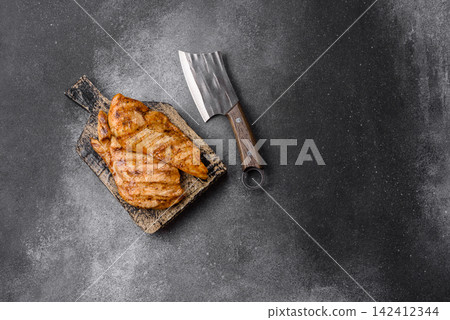 Grilled chicken steak seasoned with salt and spices. Chicken steak Grilled chicken steak seasoned with salt and spices. Chicken steak 142412344