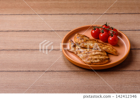 Grilled chicken steak seasoned with salt and spices. Chicken steak Grilled chicken steak seasoned with salt and spices. Chicken steak 142412346
