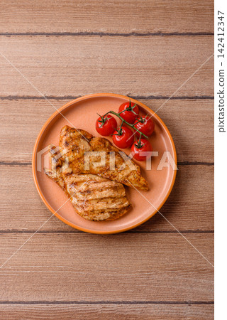 Grilled chicken steak seasoned with salt and spices. Chicken steak Grilled chicken steak seasoned with salt and spices. Chicken steak 142412347