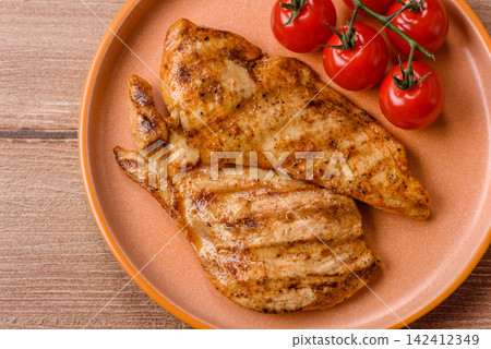 Grilled chicken steak seasoned with salt and spices. Chicken steak Grilled chicken steak seasoned with salt and spices. Chicken steak 142412349