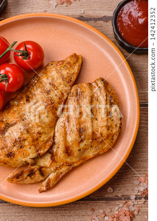 Grilled chicken steak seasoned with salt and spices. Chicken steak Grilled chicken steak seasoned with salt and spices. Chicken steak 142412352