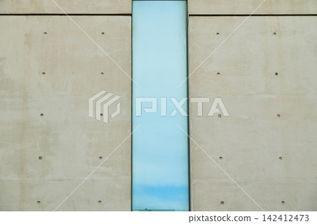 Modern glass slit windows built into exposed concrete walls Modern glass slit windows built into exposed concrete walls 142412473