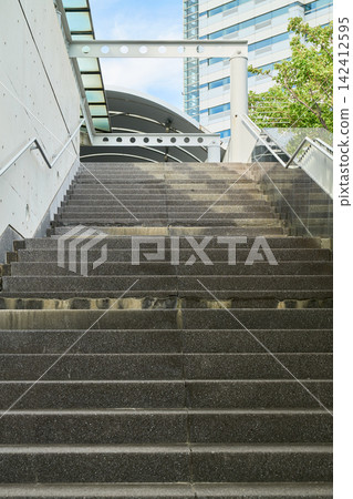 Outdoor staircases leading to public facilities and office buildings, and exposed concrete walls. Outdoor staircases leading to public facilities and office buildings, and exposed concrete walls. 142412595