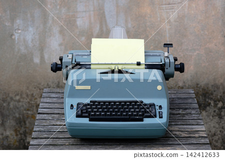 Typewriter with paper sheet 142412633