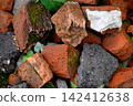 Broken old pieces of bricks and asphalt 142412638