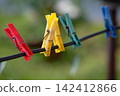 Clothespins on rope 142412866