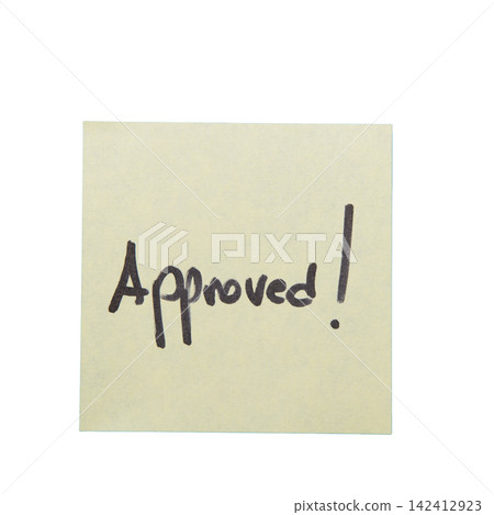 A yellow sticky note with the word "APPROVED!" written 142412923