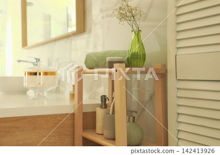 Shelving unit with toiletries in stylish bathroom interior Shelving unit with toiletries in stylish bathroom interior 142413926