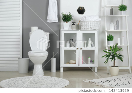 Stylish toilet bowl in modern bathroom interior 142413929