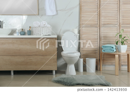 Stylish toilet bowl in modern bathroom interior 142413930