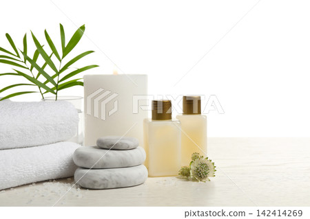 Composition with spa stones on white wooden table. Space for text Composition with spa stones on white wooden table. Space for text 142414269
