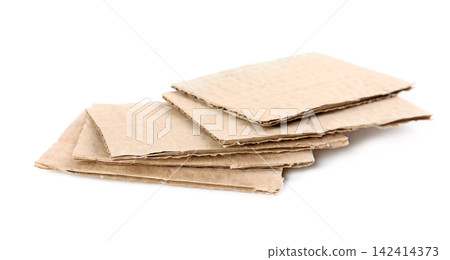 Pieces of brown cardboard isolated on white Pieces of brown cardboard isolated on white 142414373