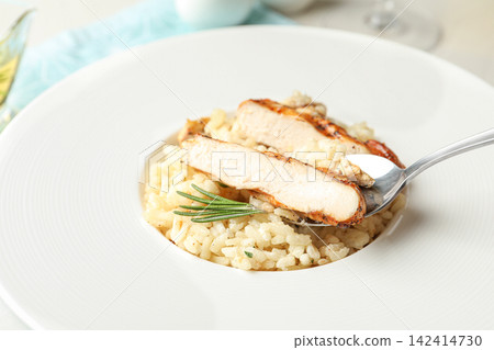 Delicious fresh chicken risotto in plate, closeup Delicious fresh chicken risotto in plate, closeup 142414730