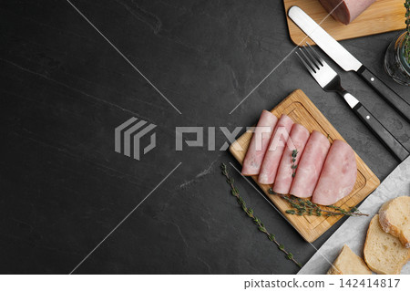 Tasty ham served on black table, flat lay. Space for text Tasty ham served on black table, flat lay. Space for text 142414817